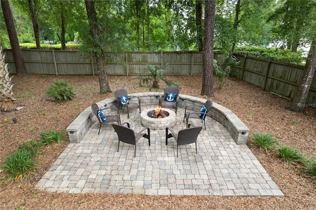 4515 SW 97th Ter, Gainesville, FL 32608 - view of patio / terrace featuring a fire pit and a fenced backyard