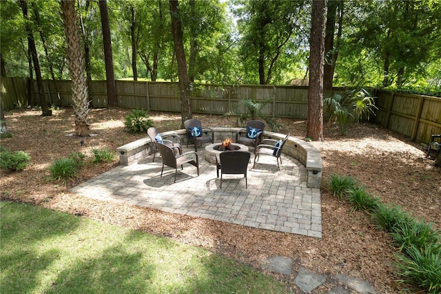 4515 SW 97th Ter, Gainesville, FL 32608 - view of patio / terrace featuring a fire pit and a fenced backyard