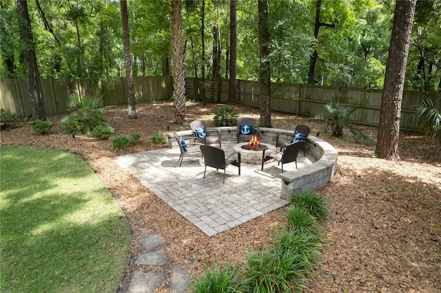 4515 SW 97th Ter, Gainesville, FL 32608 - view of patio / terrace featuring an outdoor fire pit and a fenced backyard