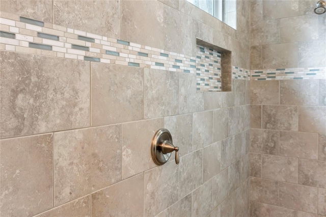 bathroom view of tiled shower
