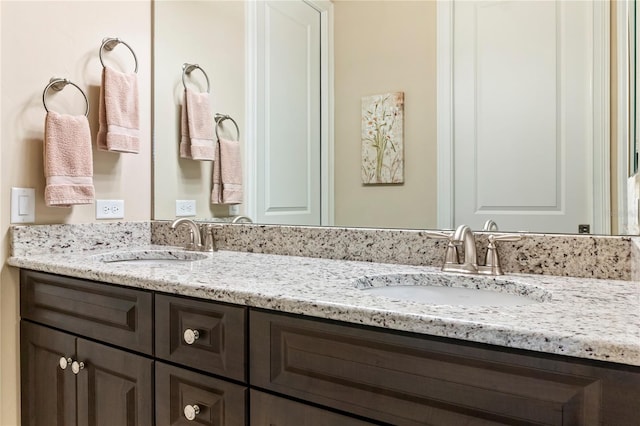 bathroom featuring double vanity