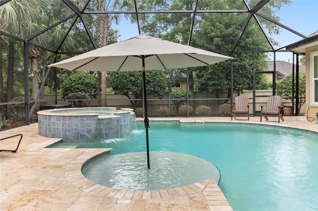 view of swimming pool with a fenced backyard, a pool with connected hot tub, glass enclosure, and a patio