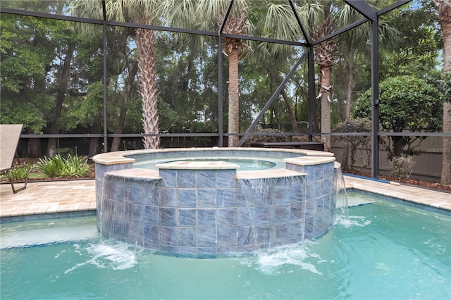 view of pool featuring a pool with connected hot tub and a lanai