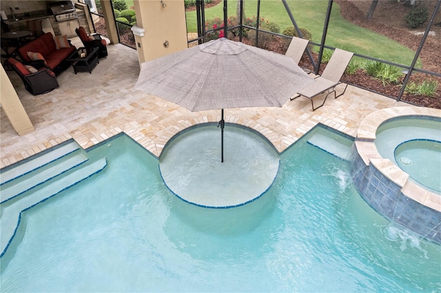 view of swimming pool featuring area for grilling, a pool with connected hot tub, a patio area, and glass enclosure