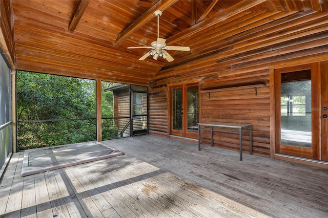 unfurnished sunroom featuring ceiling fan