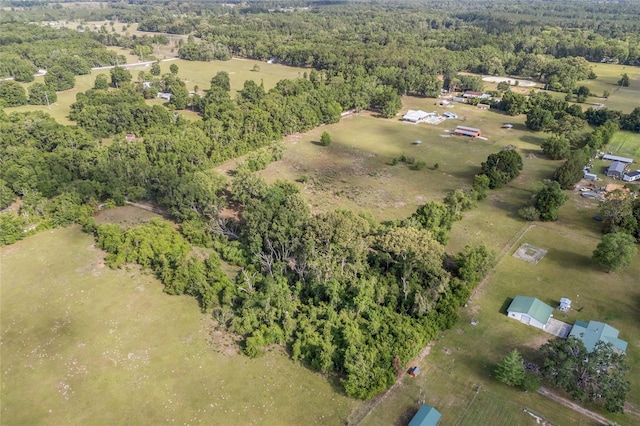 drone / aerial view with a wooded view