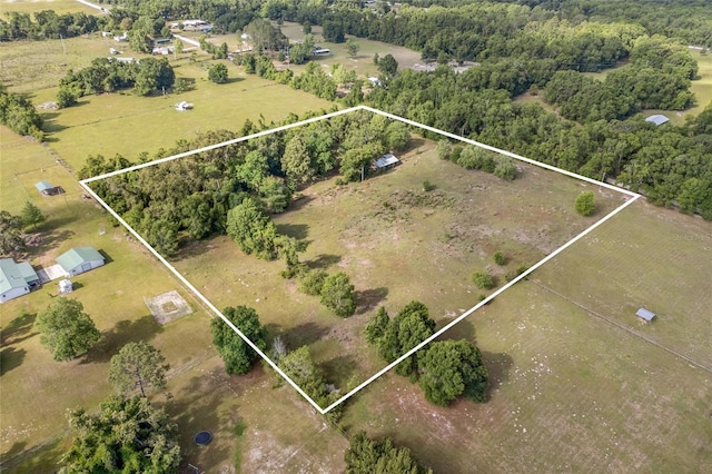 birds eye view of property with a rural view
