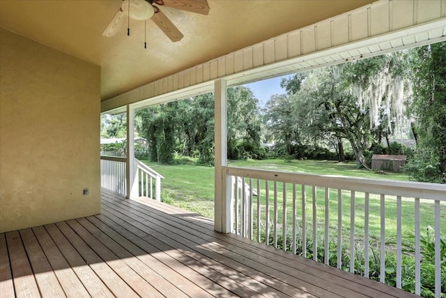 7800 SW 24th Ave, Gainesville, FL 32607 - wooden terrace with ceiling fan and a lawn