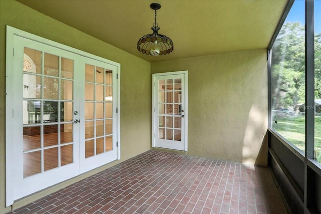 7800 SW 24th Ave, Gainesville, FL 32607 - unfurnished sunroom featuring french doors and plenty of natural light