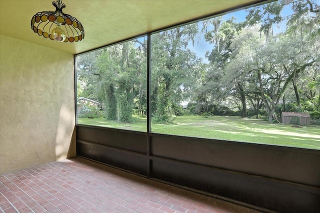7800 SW 24th Ave, Gainesville, FL 32607 - unfurnished sunroom featuring healthy amount of natural light and view of scattered trees