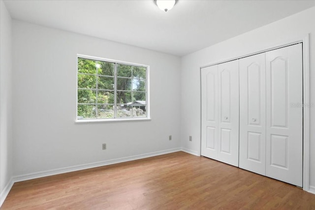 7800 SW 24th Ave, Gainesville, FL 32607 - unfurnished bedroom with light wood-type flooring and a closet