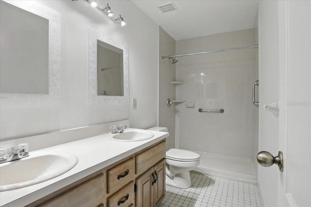 7800 SW 24th Ave, Gainesville, FL 32607 - bathroom with tile patterned floors, double vanity, and a shower