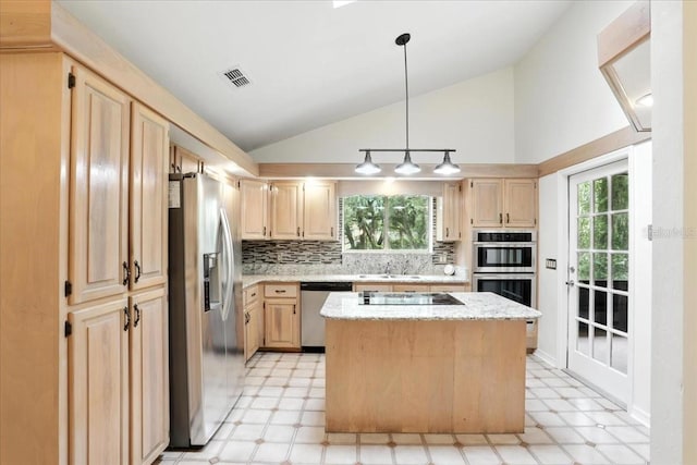 7800 SW 24th Ave, Gainesville, FL 32607 - kitchen with appliances with stainless steel finishes, light floors, light brown cabinets, vaulted ceiling, and tasteful backsplash