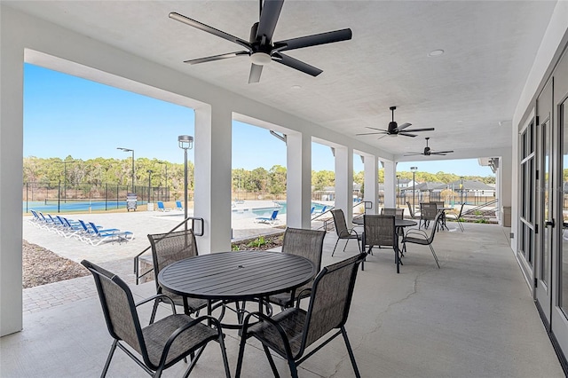 6613 SW 95th St, Gainesville, FL 32608 - view of patio featuring ceiling fan, a community pool, and outdoor dining area
