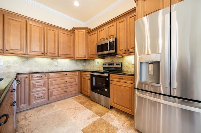 kitchen featuring brown cabinetry, ornamental molding, decorative backsplash, dark stone countertops, and appliances with stainless steel finishes