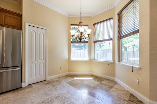 unfurnished dining area featuring baseboards, a chandelier, and ornamental molding