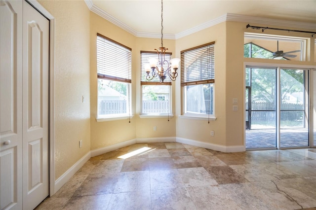 unfurnished dining area featuring baseboards, ornamental molding, a textured wall, and a wealth of natural light