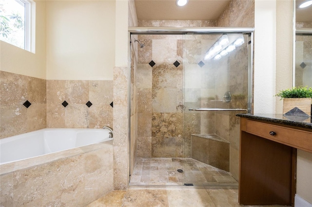 bathroom with vanity, a bath, a stall shower, and recessed lighting