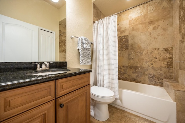 full bath with vanity, tile patterned floors, toilet, and shower / tub combo