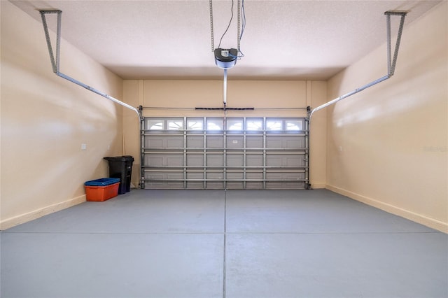 garage featuring baseboards and a garage door opener