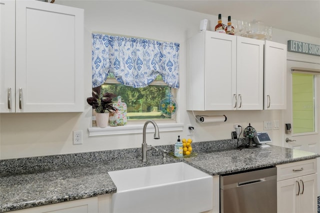 kitchen featuring a sink, white cabinetry, and dishwasher