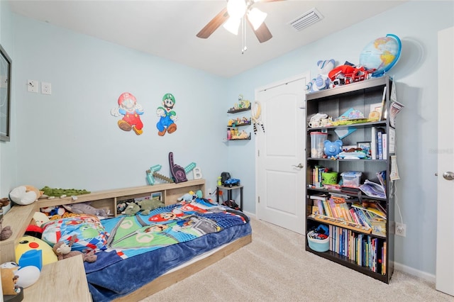 bedroom with baseboards, a ceiling fan, carpet flooring, and visible vents