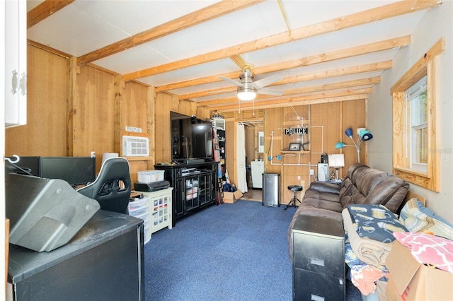 carpeted living area featuring ceiling fan and wood walls