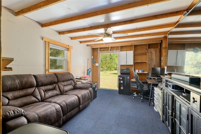 living room with ceiling fan, beamed ceiling, and dark colored carpet