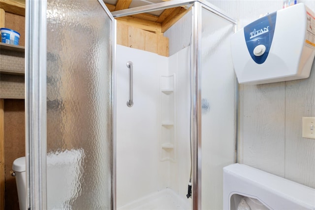 full bath with toilet and a shower stall