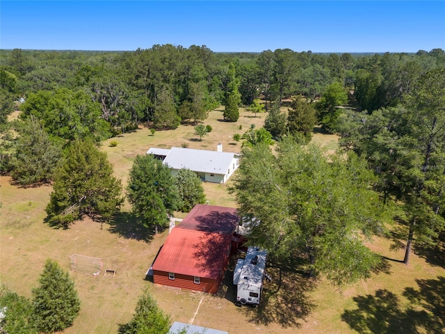 birds eye view of property with a wooded view