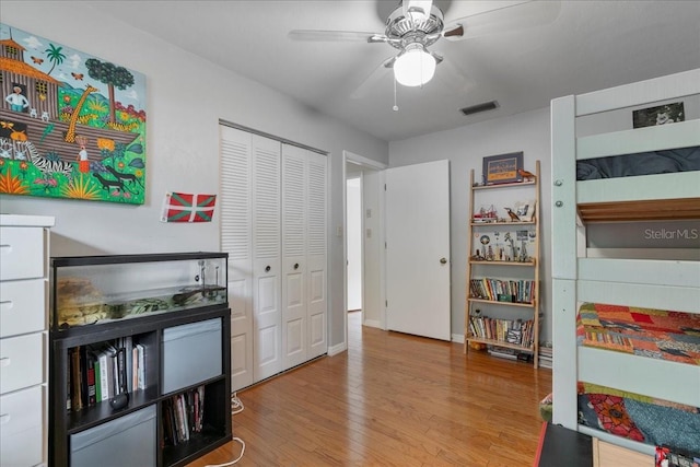 game room featuring ceiling fan, wood finished floors, and visible vents