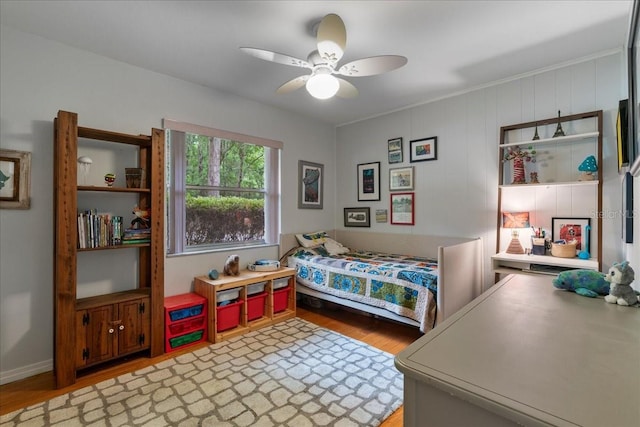 bedroom featuring light wood-style floors and a ceiling fan