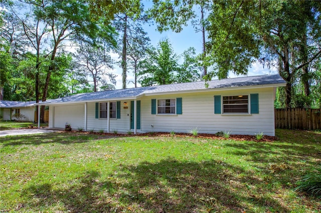 single story home with fence, driveway, a front yard, and a garage