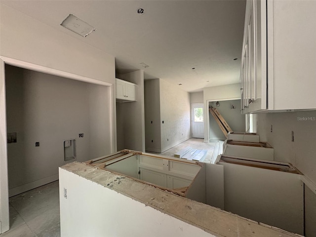 23324 NW 178th Ave, High Springs, FL 32643 - kitchen featuring white cabinets and baseboards