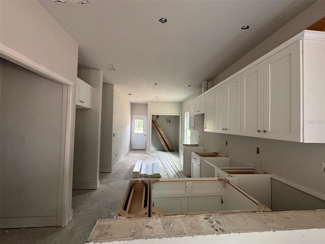 23324 NW 178th Ave, High Springs, FL 32643 - kitchen featuring white cabinets and concrete floors