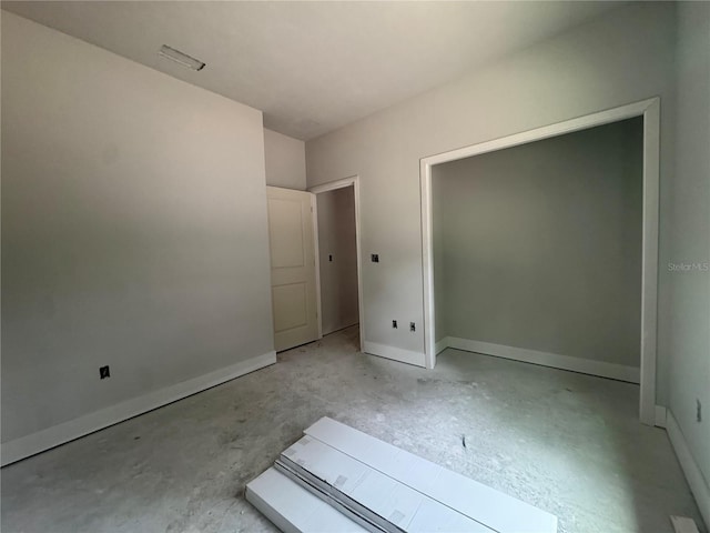 23324 NW 178th Ave, High Springs, FL 32643 - unfurnished bedroom with baseboards and concrete floors