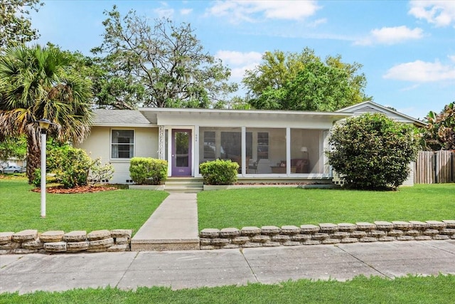 single story home with fence and a front yard