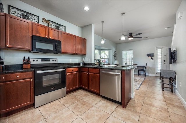 kitchen with stainless steel appliances, ceiling fan, light tile patterned floors, and a peninsula