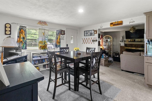 1529 NW 143rd St, Gainesville, FL 32606 - dining space with light colored carpet and a textured ceiling