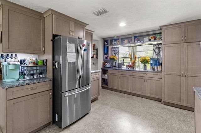 1529 NW 143rd St, Gainesville, FL 32606 - kitchen featuring freestanding refrigerator, stone counters, and open shelves