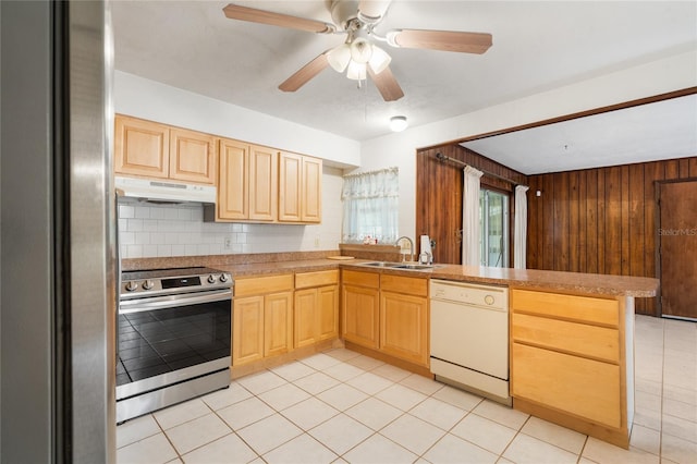 5620 NW 25th St, Gainesville, FL 32653 - kitchen with a peninsula, a sink, light brown cabinets, under cabinet range hood, and appliances with stainless steel finishes