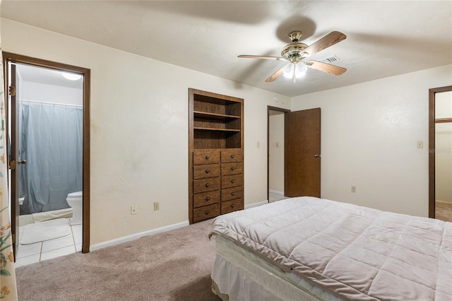 5620 NW 25th St, Gainesville, FL 32653 - carpeted bedroom with baseboards, ceiling fan, connected bathroom, and visible vents