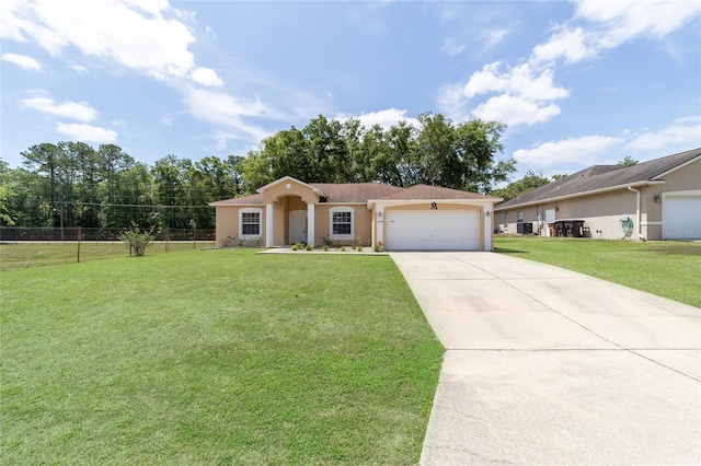 2648 NE 24th Pl, Ocala, FL 34470 - ranch-style house with a garage, a front lawn, fence, stucco siding, and concrete driveway