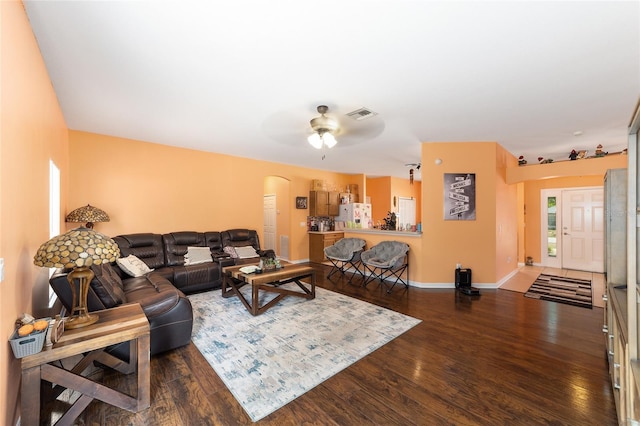 2648 NE 24th Pl, Ocala, FL 34470 - living room with baseboards, ceiling fan, wood finished floors, and visible vents