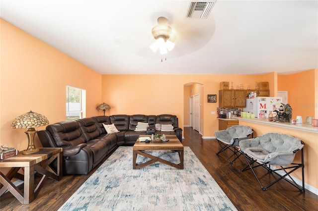 2648 NE 24th Pl, Ocala, FL 34470 - living area with arched walkways, ceiling fan, dark wood-style floors, and visible vents