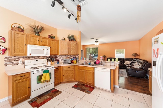 2648 NE 24th Pl, Ocala, FL 34470 - kitchen featuring backsplash, visible vents, light countertops, open floor plan, and white appliances