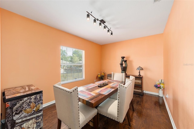 2648 NE 24th Pl, Ocala, FL 34470 - dining space with baseboards, track lighting, and wood finished floors