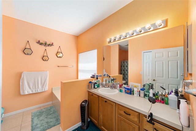 2648 NE 24th Pl, Ocala, FL 34470 - bathroom featuring a garden tub, baseboards, tile patterned flooring, and vanity
