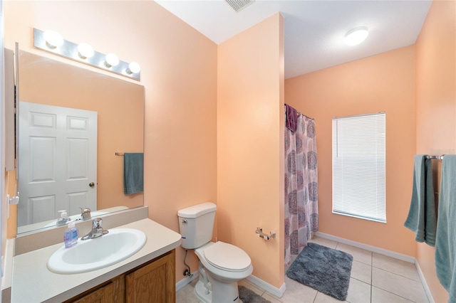 2648 NE 24th Pl, Ocala, FL 34470 - bathroom with vanity, tile patterned flooring, toilet, baseboards, and a shower with curtain