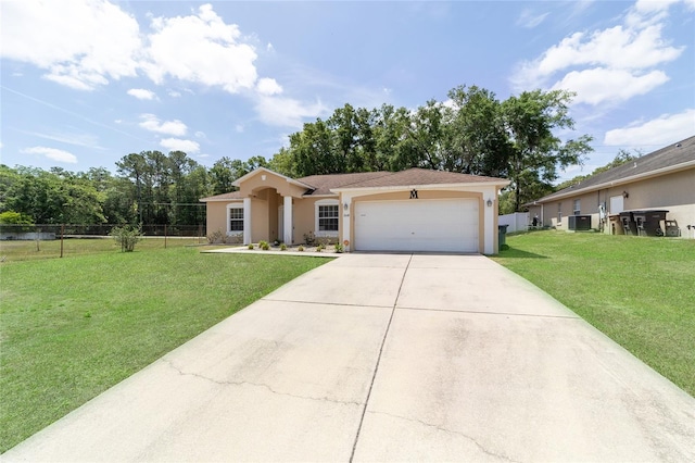 2648 NE 24th Pl, Ocala, FL 34470 - ranch-style home with concrete driveway, an attached garage, a front yard, and stucco siding